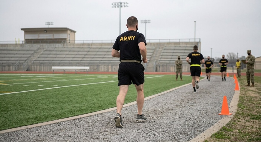 U.S. Army Soldiers completing the Two-Mile Run event on an outdoor track